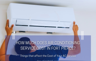 Person mounting a white wall-mounted air conditioner unit high on a wall, hands on each side.”